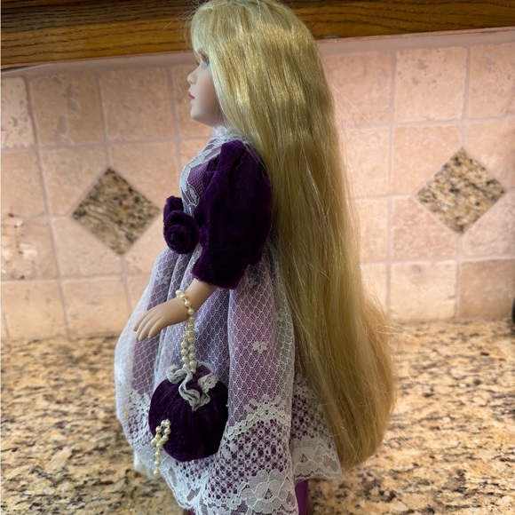 Vintage 16” Porcelain Doll with purple dress and blonde hair, blue eyes. - Picture 2 of 6